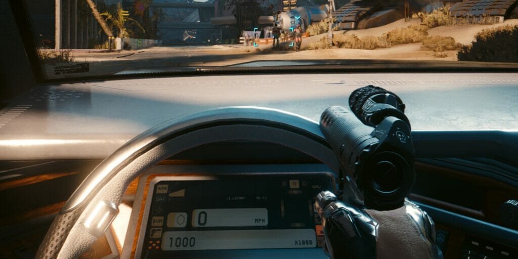 V lines up a shot from their car in Cyberpunk 2077