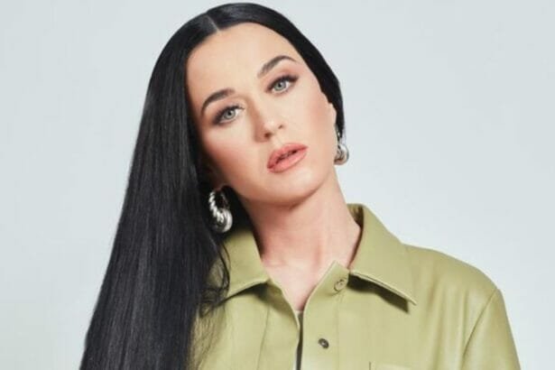 Katy Perry poses indoor in green shirt
