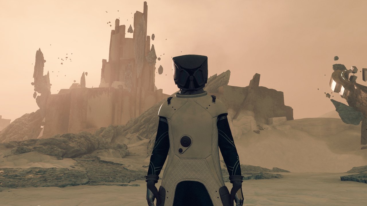 The main character stands before an alien structure in Starfield